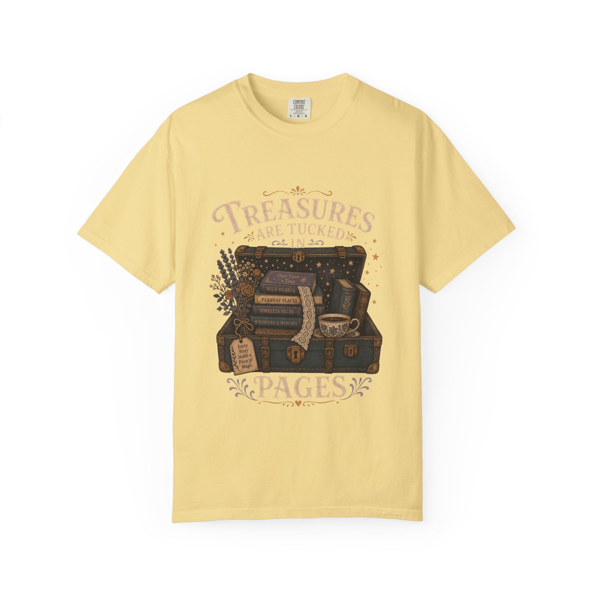 Treasures Are Tucked in Pages book lover T-shirt in Butter with a vintage trunk, books, flowers and teacup artwork