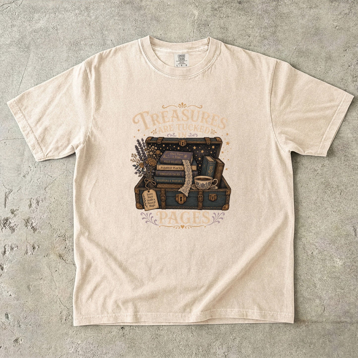 Treasures Are Tucked in Pages book lover T-shirt in Ivory with a vintage trunk, books, flowers and teacup artwork