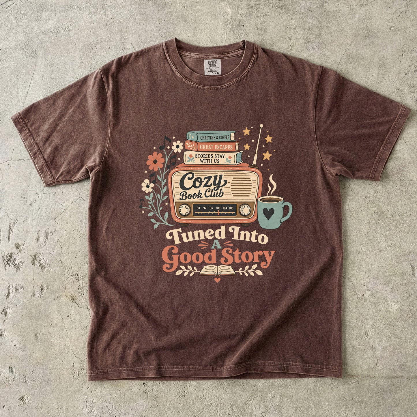 Front view of an Espresso Comfort Colors Book Lover T-shirt with a vintage radio, books and coffee illustration.