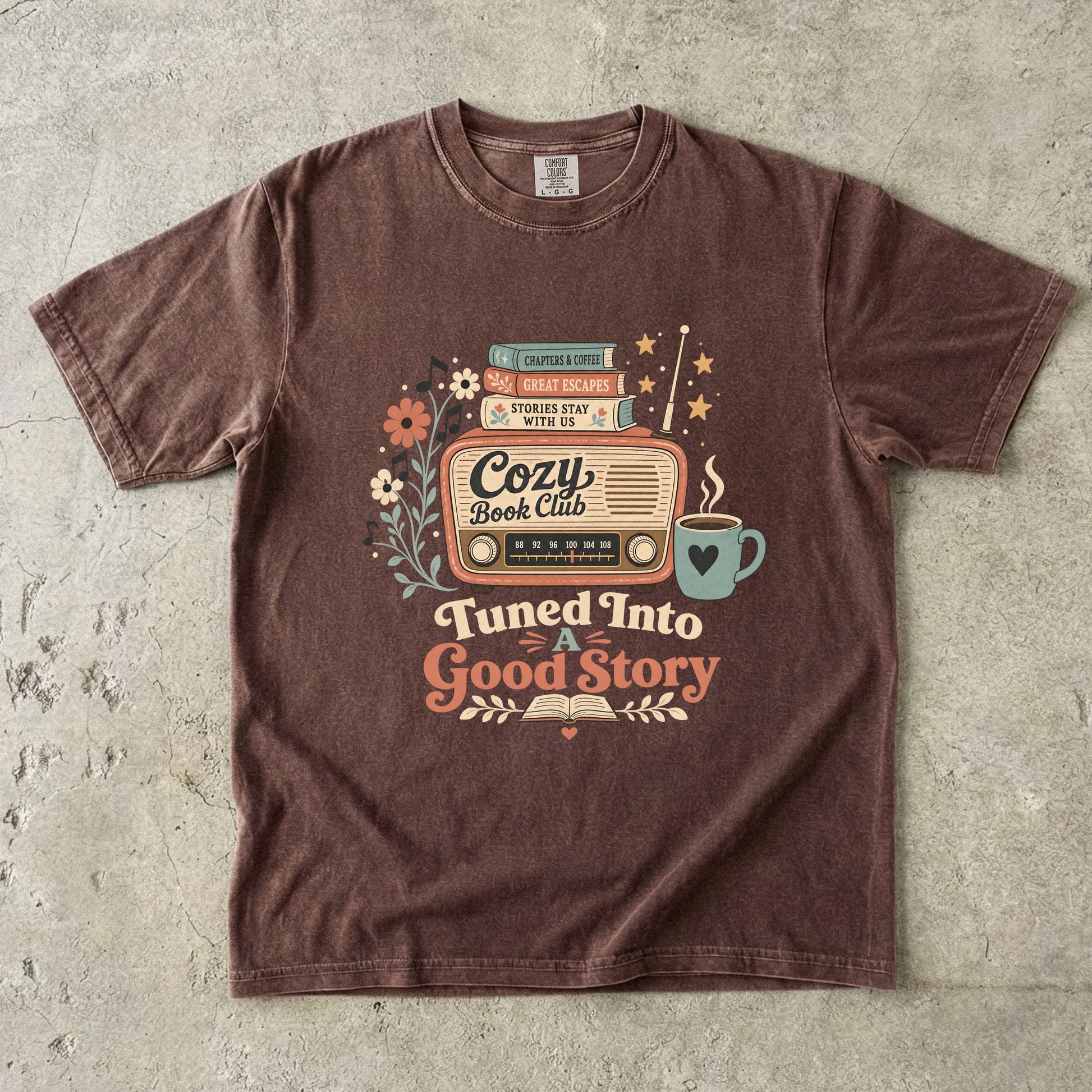 Front view of an Espresso Comfort Colors Book Lover T-shirt with a vintage radio, books and coffee illustration.