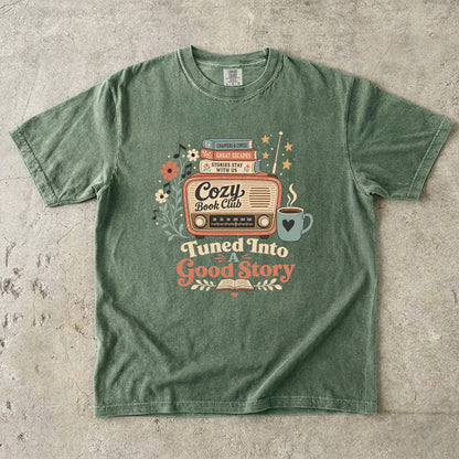 Front view of a Moss Comfort Colors Book Lover T-shirt featuring the vintage book club radio illustration.