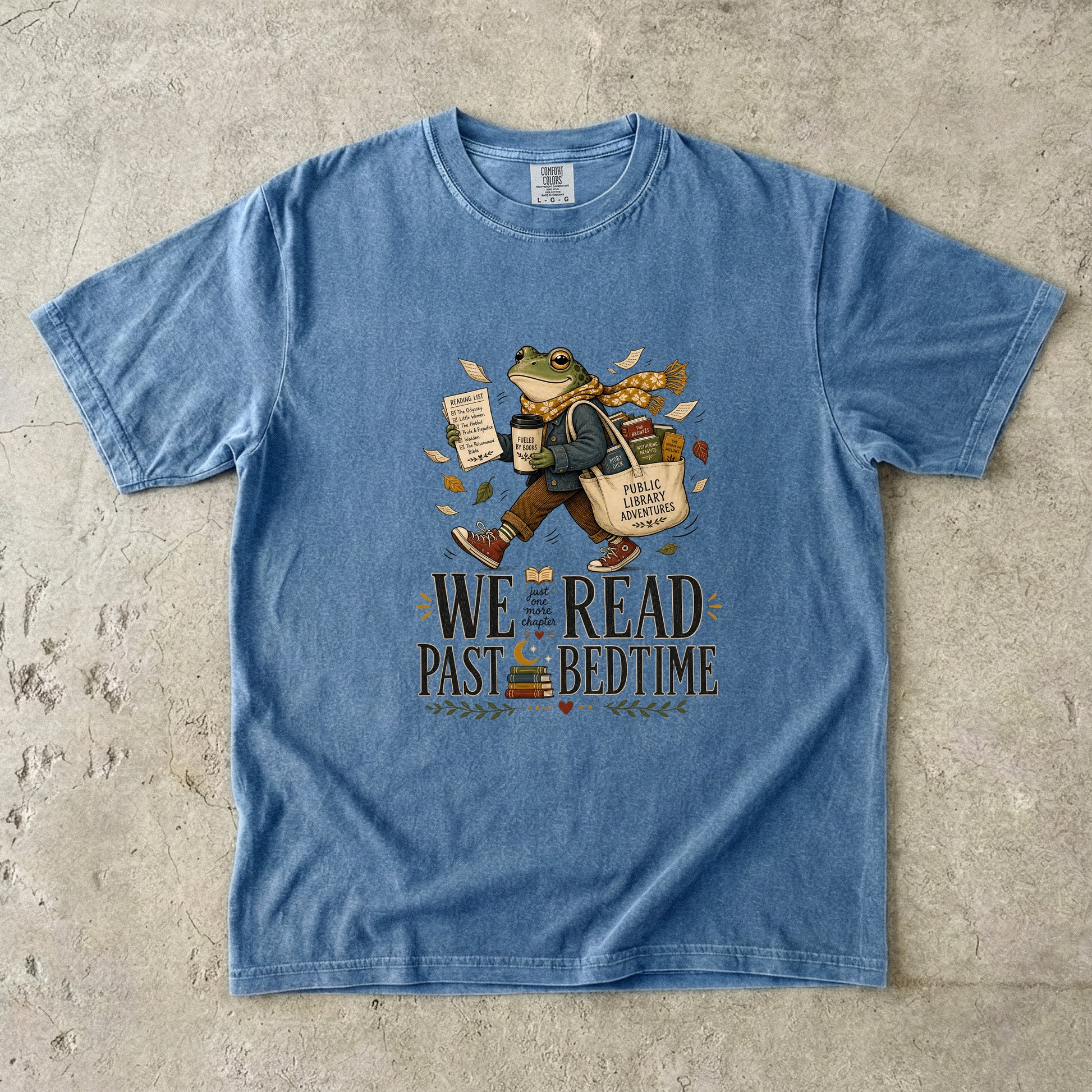 Blue Jean Comfort Colors book lover T-shirt with the playful We Read Past Bedtime frog and library adventure design.
