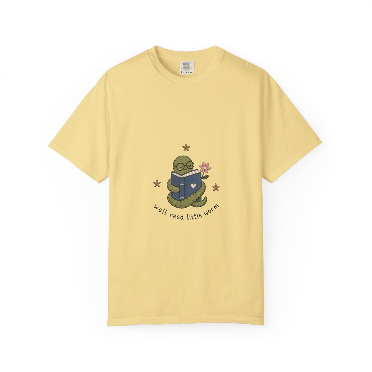 Well Read Little Worm book lover T-shirt featuring a cute green bookworm reading a blue book with flowers and stars on Butter.