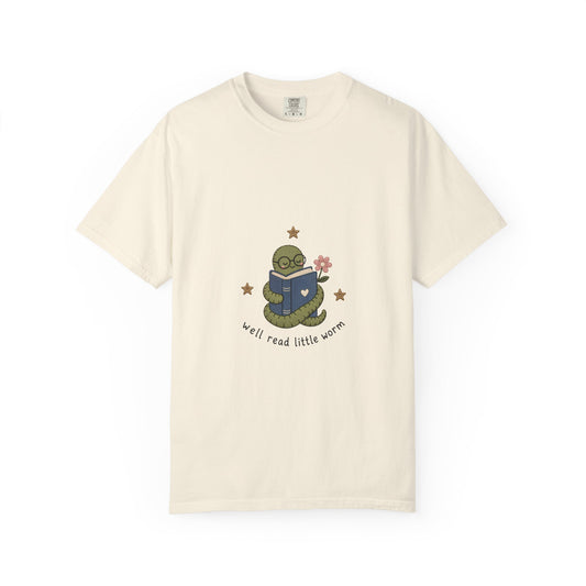 Well Read Little Worm book lover T-shirt featuring a cute green bookworm reading a blue book with flowers and stars on Ivory.