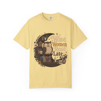Wise Women Read Late night owl reading T-shirt in Butter featuring an owl, crescent bookshelf, books, flowers and candles