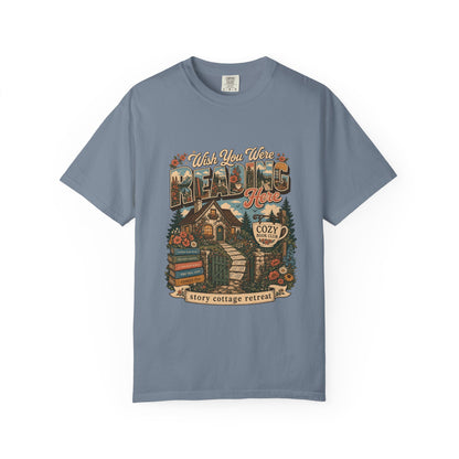 Wish You Were Reading Here book lover T-shirt with story cottage and garden reading retreat design on Blue Jean.