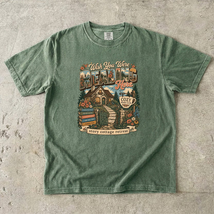 Wish You Were Reading Here book lover T-shirt with story cottage and garden reading retreat design on Moss.